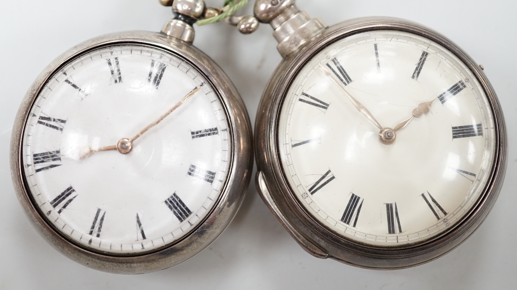 Two Victorian silver pair cased keywind verge pocket watches by Henry Steward of York and Eaton of London.